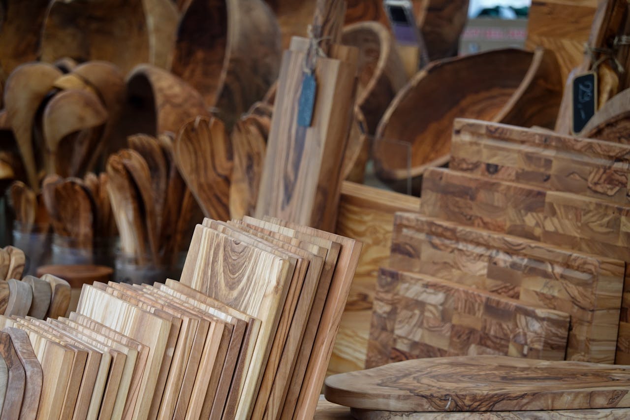 Home A collection of rustic kitchenware made from carved wood, ideal for home decor and culinary use.